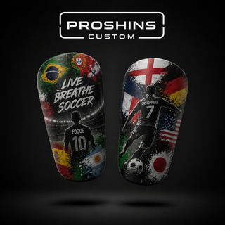 Two soccer-themed shin guards with motivational phrases and world flags on a black background, branded 'Proshins Custom'.
